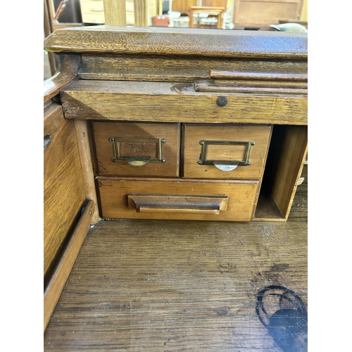 176 - An early 20th century Lebus oak roll top desk - approx. 102cm high x 107cm wide x 69cm deep