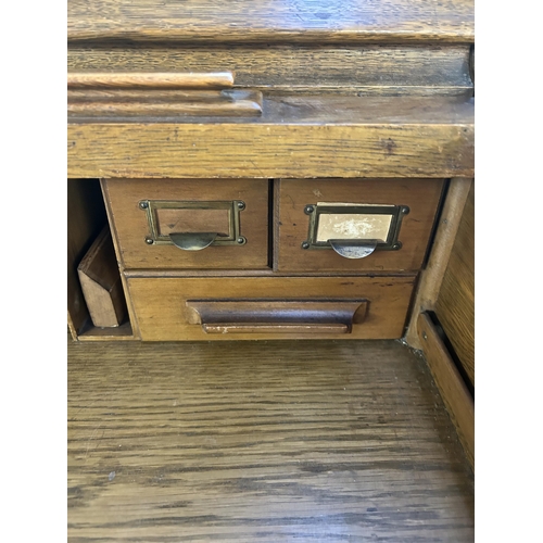 176 - An early 20th century Lebus oak roll top desk - approx. 102cm high x 107cm wide x 69cm deep