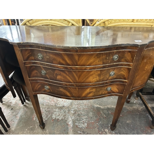 188 - A 19th century style mahogany serpentine sideboard