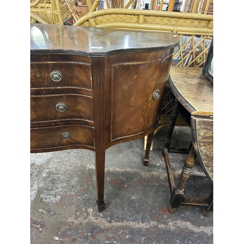 188 - A 19th century style mahogany serpentine sideboard