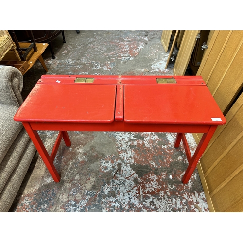 19 - A mid 20th century Kingfisher Ltd. red painted twin school desk
