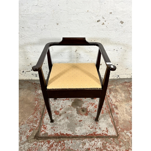 197 - An Edwardian mahogany and fabric upholstered piano stool