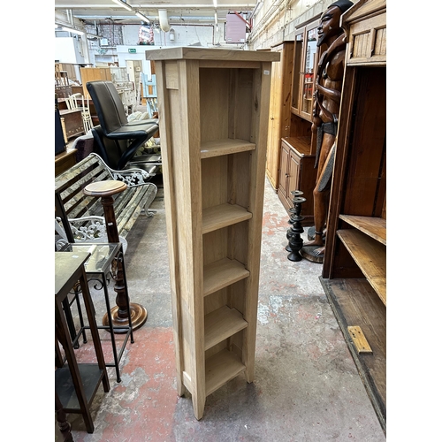 2 - A modern oak five tier bookcase - approx. 152cm high x 38cm wide x 22cm deep