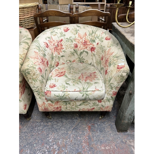 209 - A pair of Victorian style floral fabric upholstered armchairs with turned wooden supports and brass ... 