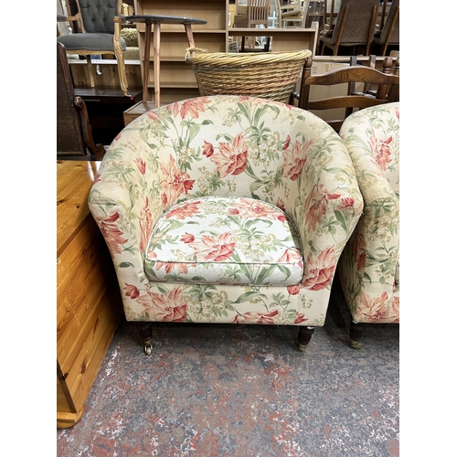 209 - A pair of Victorian style floral fabric upholstered armchairs with turned wooden supports and brass ... 