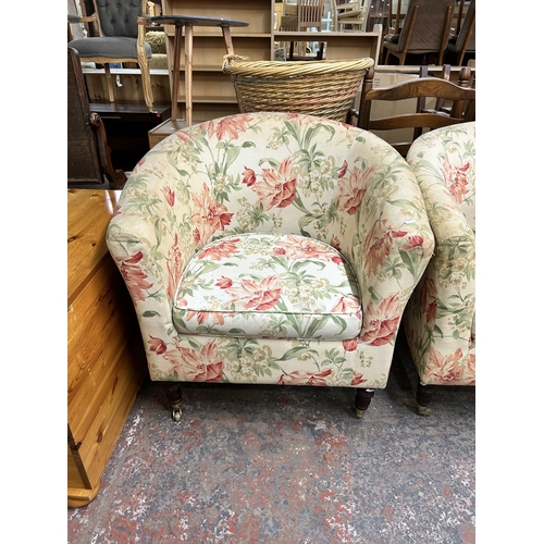 209 - A pair of Victorian style floral fabric upholstered armchairs with turned wooden supports and brass ... 