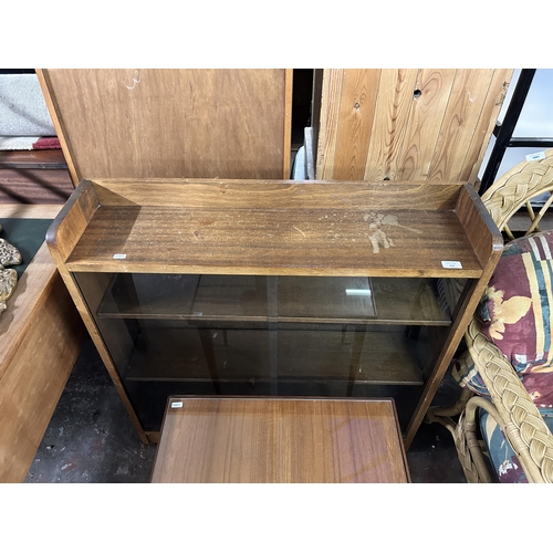 214 - Two pieces of mid 20th century teak furniture, one bookcase and one side table