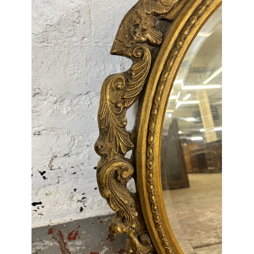 214A - A 19th century style gilt framed bevelled edge wall mirror - approx. 89cm high x 70cm wide