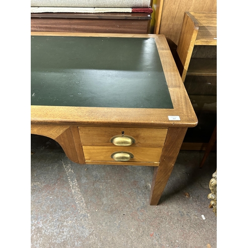 217 - A mid 20th century teak office desk - approx. 76cm high x 153cm wide x 83cm deep