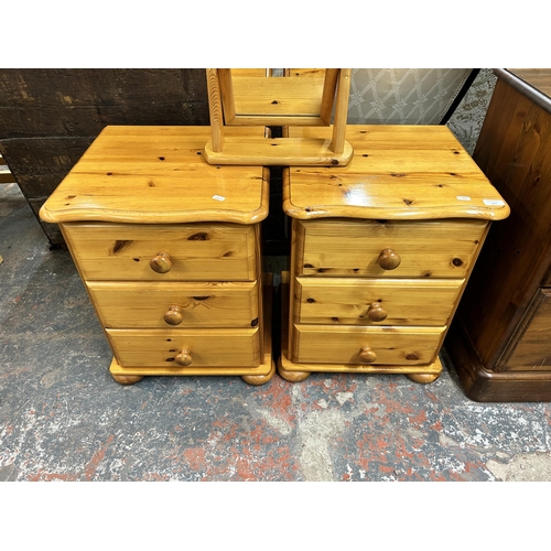 231 - A pair of modern pine bedside chests of drawers