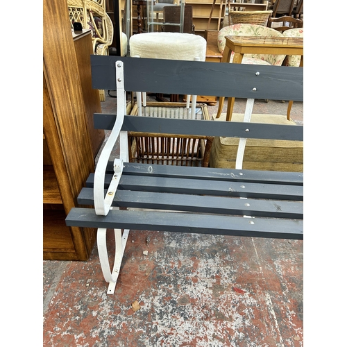 241 - A grey and white painted wooden and wrought metal garden bench - approx. 86cm high x 183cm wide x 65... 