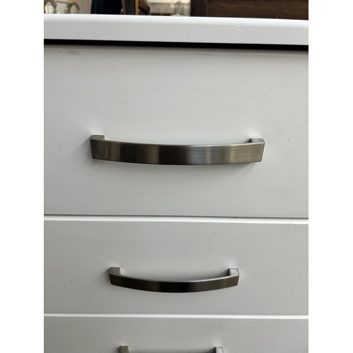 248 - A modern white laminate chest of drawers - approx. 66cm high x 77cm wide x 45cm deep