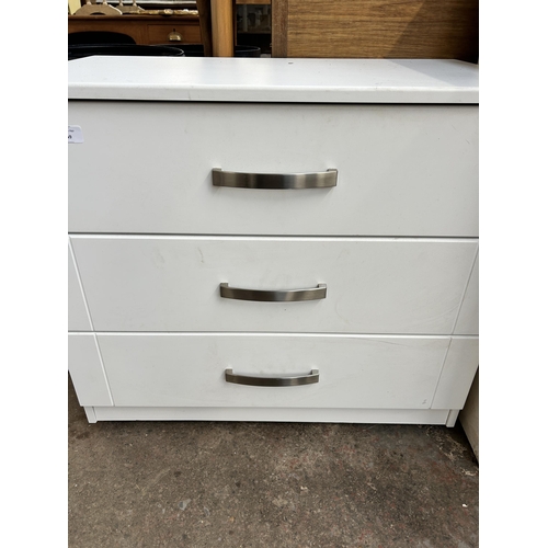 249 - A modern white laminate chest of drawers - approx. 66cm high x 77cm wide x 45cm deep