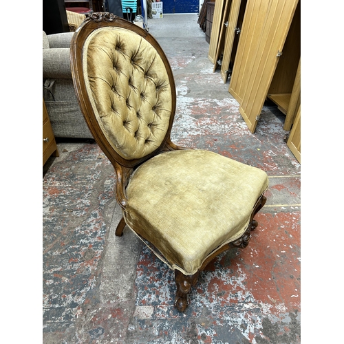 25 - A Victorian carved walnut and fabric upholstered spoon back nursing chair - approx. 90cm high x 56cm... 