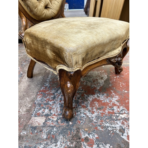 25 - A Victorian carved walnut and fabric upholstered spoon back nursing chair - approx. 90cm high x 56cm... 