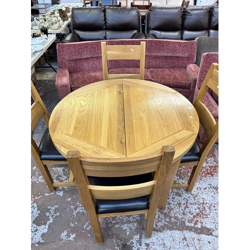 259 - A Besp-Oak solid oak circular extending dining table and four chairs - approx. 79cm high x 110cm dia... 