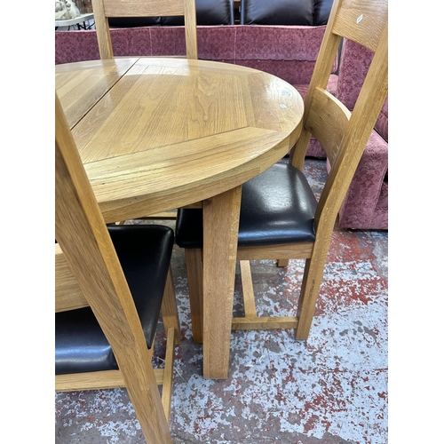 259 - A Besp-Oak solid oak circular extending dining table and four chairs - approx. 79cm high x 110cm dia... 