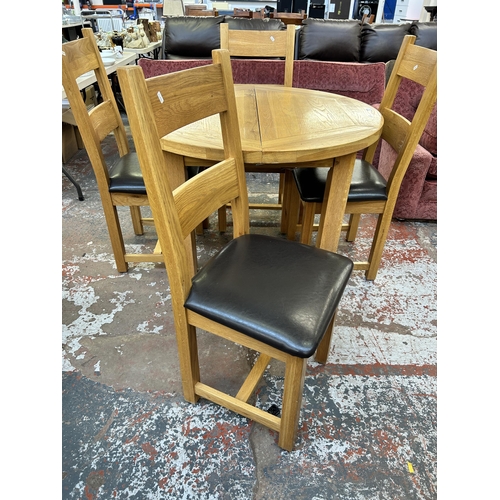 259 - A Besp-Oak solid oak circular extending dining table and four chairs - approx. 79cm high x 110cm dia... 