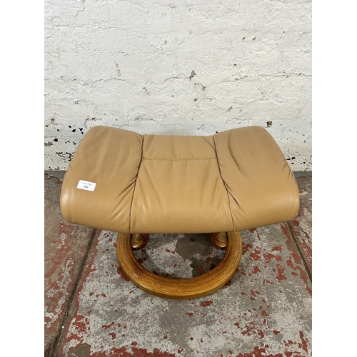 261 - An Ekornes Stressless tan leather and beech footstool