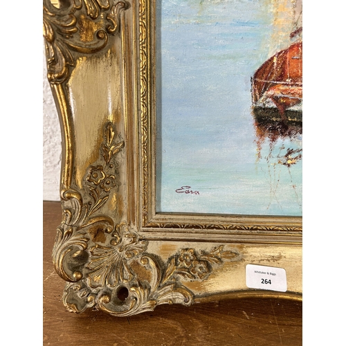 264 - A gilt framed oil on canvas of a harbour scene - approx. 56cm high x 67cm wide