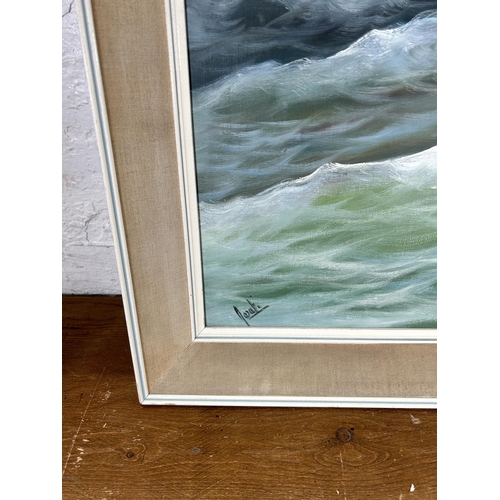 275 - A framed oil on canvas of a seascape, signed lower left - approx. 69cm high x 129cm wide