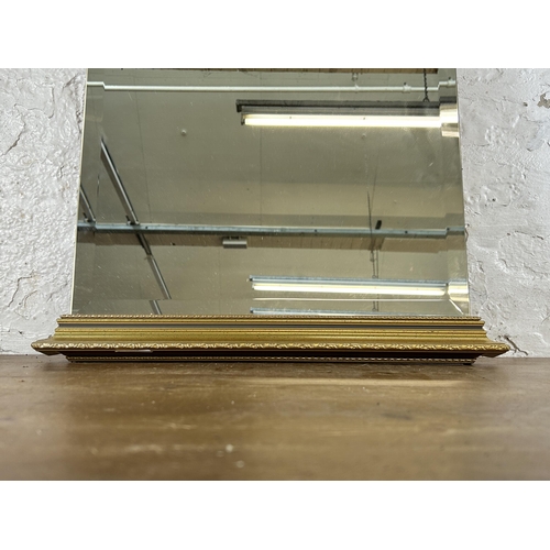 280 - A gilt framed bevelled edge wall mirror - approx. 80cm high x 52cm wide