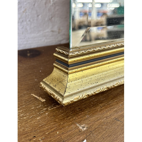 280 - A gilt framed bevelled edge wall mirror - approx. 80cm high x 52cm wide