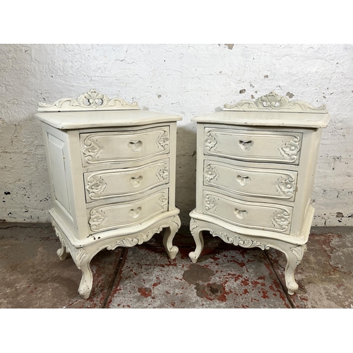 56 - A pair of French style white painted bedside chests of drawers - approx. 79cm high x 50cm wide x 40c... 