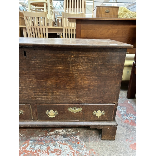 63 - A Georgian oak blanket box with two lower drawers and bracket supports - approx. 64cm high x 107cm w... 
