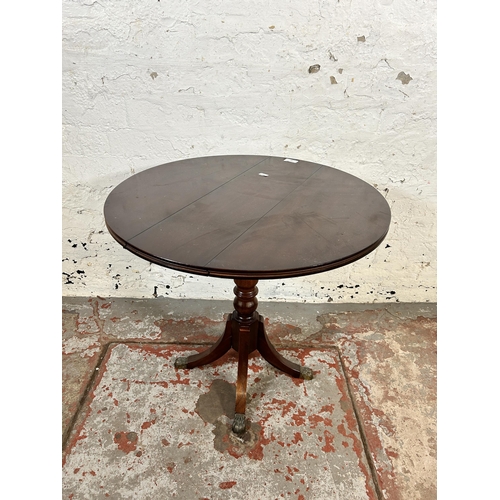 83 - A 19th century style mahogany drop leaf pedestal side table with brass lion paw supports - approx. 5... 