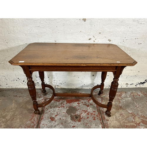 91 - A late 19th/early 20th century oak console table with lower H stretcher - approx. 75cm high x 106cm ... 