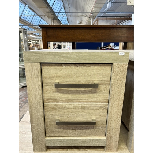 92 - A pair of modern oak effect bedside chests of drawers - approx. 56cm high x 48cm wide x 42cm deep