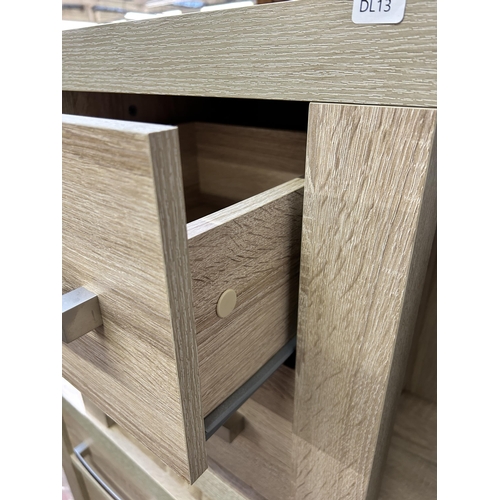 92 - A pair of modern oak effect bedside chests of drawers - approx. 56cm high x 48cm wide x 42cm deep