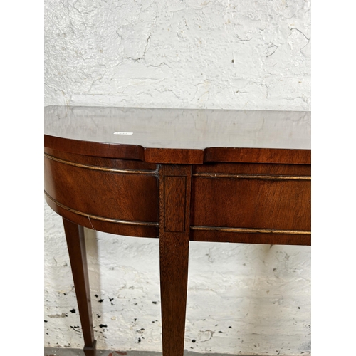 94 - A Bevan Funnell mahogany serpentine console table - approx. 82cm high x 122cm wide x 34cm deep