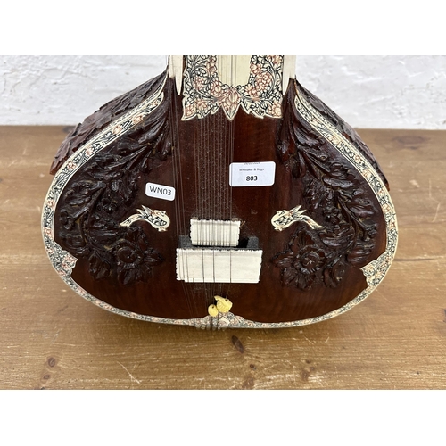 803 - An ornately carved and decorated standard sitar