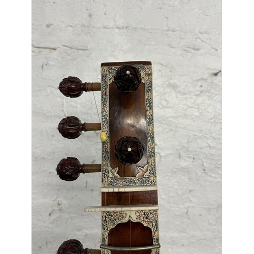 803 - An ornately carved and decorated standard sitar