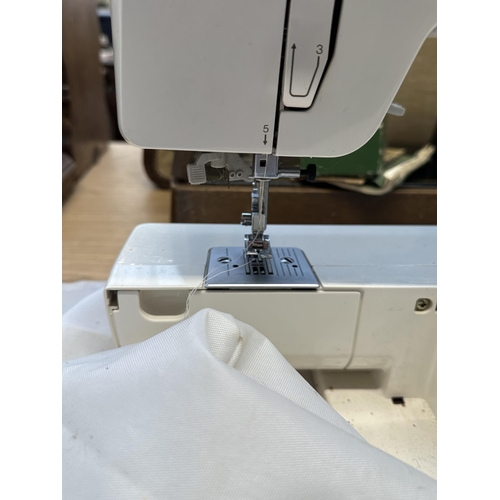 814 - A Brother XL-5011 electric sewing machine with cover