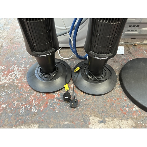 838 - Three floor standing fans, two Honeywell Quiet Set tower and one black plastic