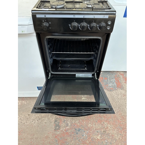 845E - A Currys Essentials CFSGBK22 four burner hob single oven 50cm gas cooker