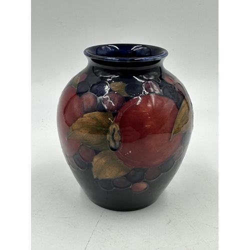 309 - A Moorcroft Pomegranate pattern vase - approx. 10.5cm high