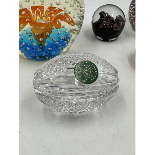 325 - Five art glass paperweights to include Welsh Royal Crystal, Caithness Scotland Millennium 2000, Isle... 