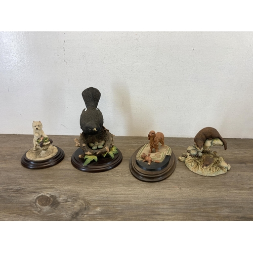 343 - A collection of resin animal figurines to include Country Artists, Aynsley MasterCraft, Teviotdale e... 