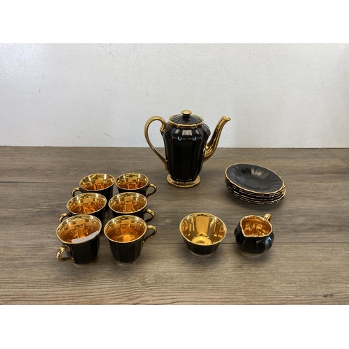 357 - A Wade black and gold fifteen piece coffee set