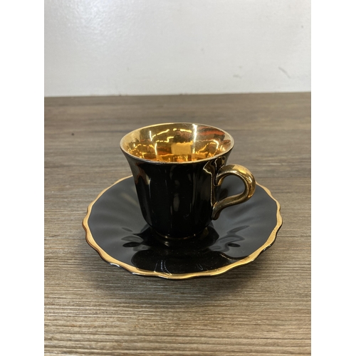 357 - A Wade black and gold fifteen piece coffee set