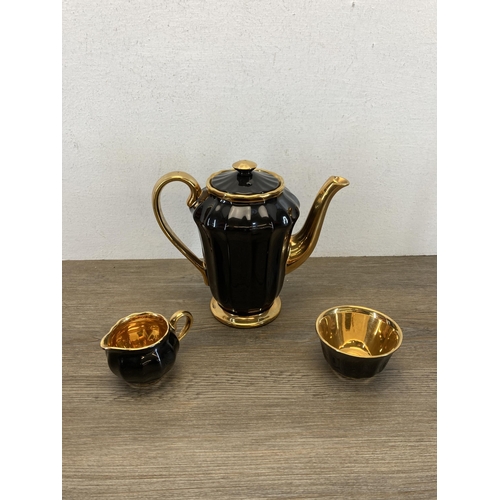 357 - A Wade black and gold fifteen piece coffee set