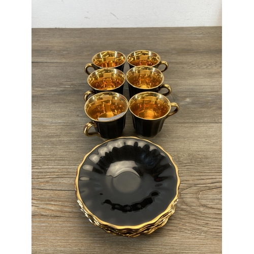 357 - A Wade black and gold fifteen piece coffee set