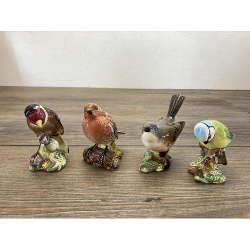 374 - Nine animal figurines, one Teviotdale resin owl and eight ceramic to include Royal Doulton Cat HN999... 