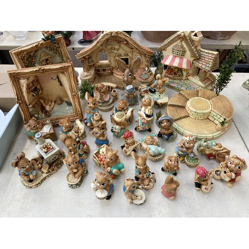 378 - A collection of Pendelfin rabbit figurines and display stands to include Old Schoolhouse, Fruit Shop... 