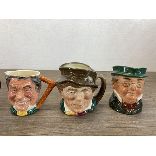 384 - Nine ceramic miniature character jugs, eight Royal Doulton and one Lancaster Sandland