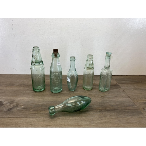 385 - Six antique glass bottles to include Smith's Swinton, Hoe's Sauce etc.